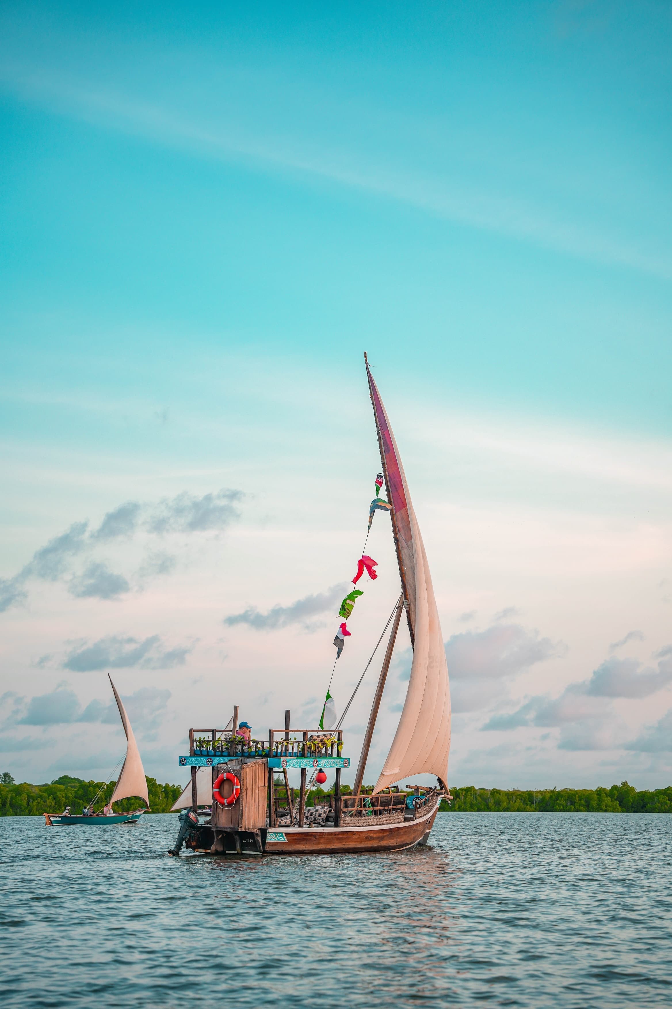 Traditional dhow sailing on a calm lagoon
